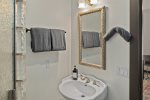 Walk in glass tiled shower